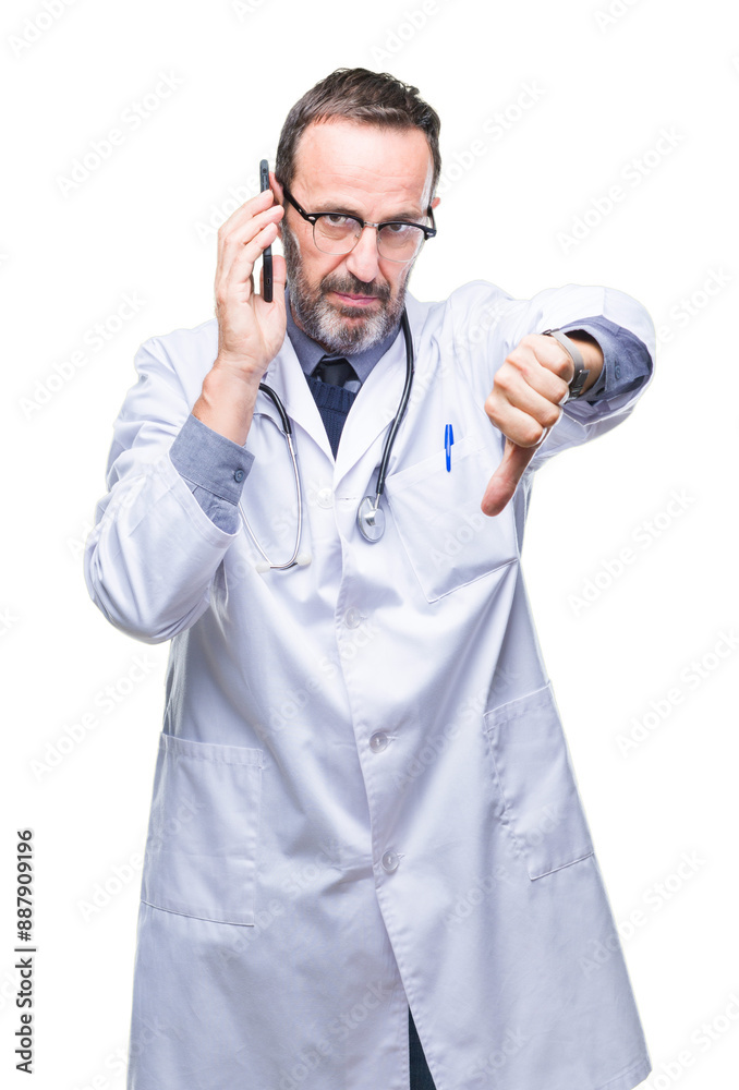 Middle age senior hoary doctor man talking on smartphone over isolated background with angry face, negative sign showing dislike with thumbs down, rejection concept Middle age senior hoary doctor man talking on smartphone over isolated background with angry face, negative sign showing dislike with thumbs down, rejection concept