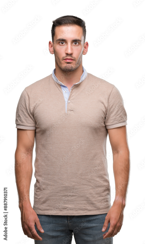 Handsome young man with a confident expression on smart face thinking serious Handsome young man with a confident expression on smart face thinking serious