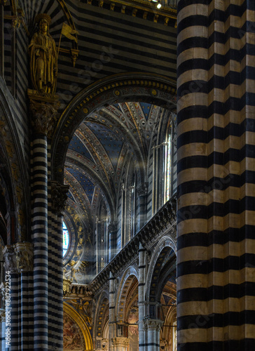 light rays coming through a window in an ols italian church in siena 