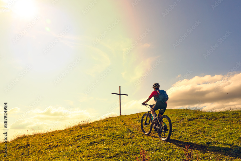 Naklejka premium nice active senior woman riding her electric mountain bike at Mount Huendle in Oberstaufen, Allgaeu Alps , Bavaria, Germany