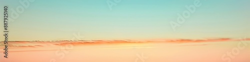 Soft gradient transitioning from pastel orange to light blue, evoking a peaceful sunset sky. © Kanwal