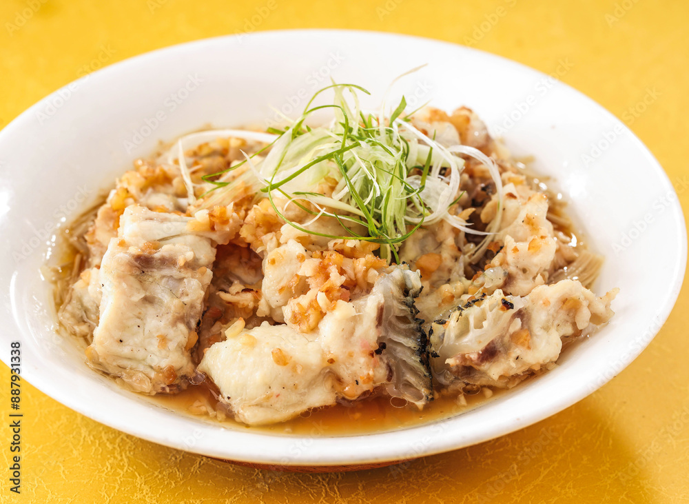 Steamed Dragon Pork with Gold and Silver Garlic paste served in dish isolated on background side view of hong kong food Steamed Dragon Pork with Gold and Silver Garlic paste served in dish isolated on background side view of hong kong food