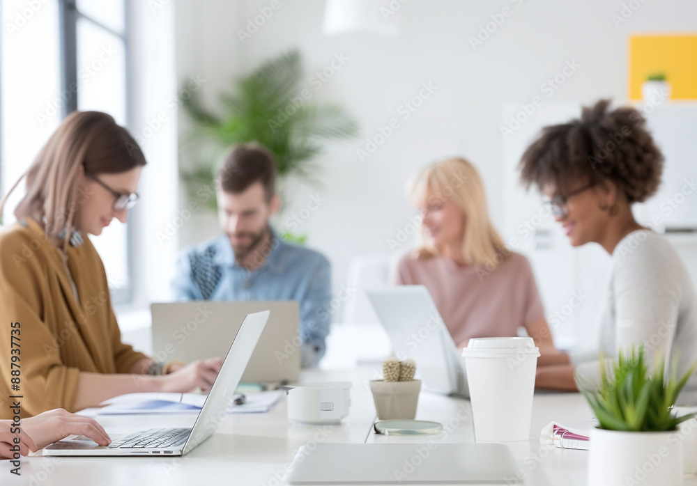 Group of employees sitting with laptops on the Job meeting in the office. Meeting room background Group of employees sitting with laptops on the Job meeting in the office. Meeting room background