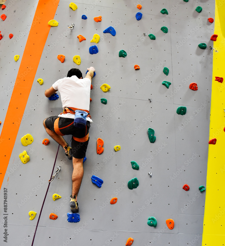 Athletes training on climbing wall Athletes training on climbing wall
