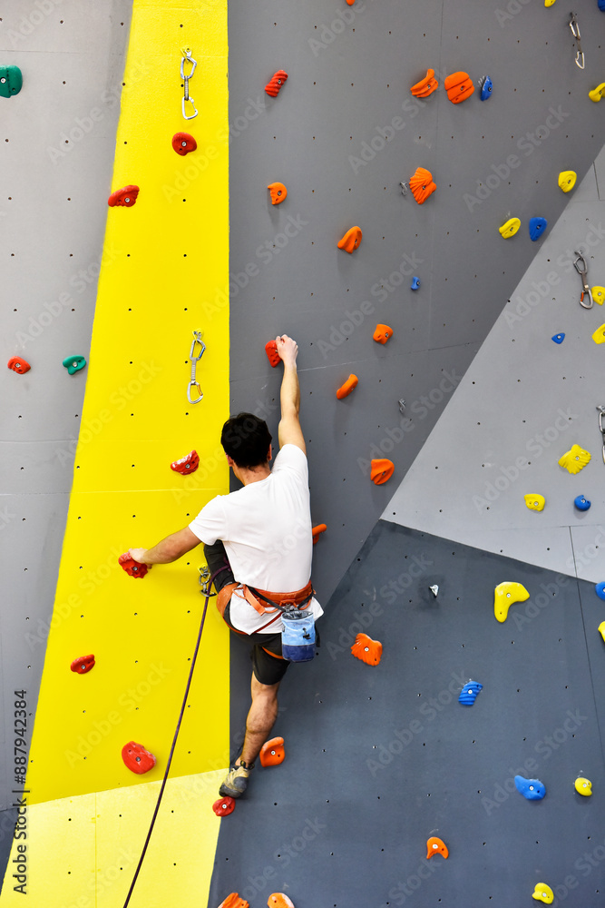 Athletes training on climbing wall Athletes training on climbing wall