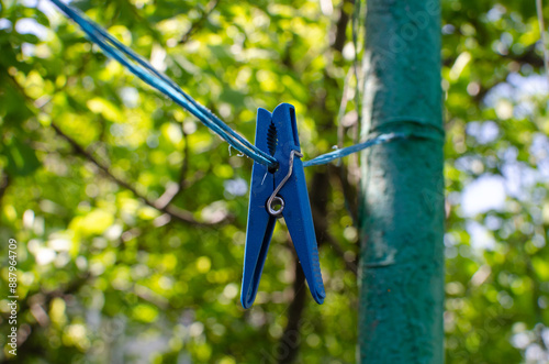 Clothespins and Clothes line on blur background