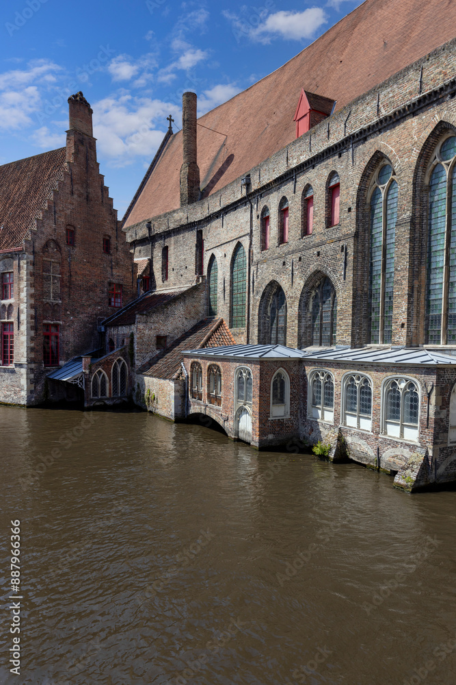 View of Rosary Quay (Rozenhoedkaai) by the water channel Dijver Canal, Bruges, Belgium