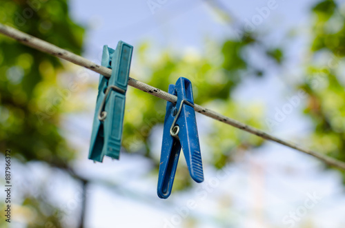 Clothespins and Clothes line on blur background