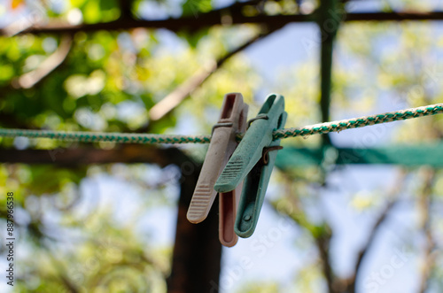 Clothespins and Clothes line on blur background