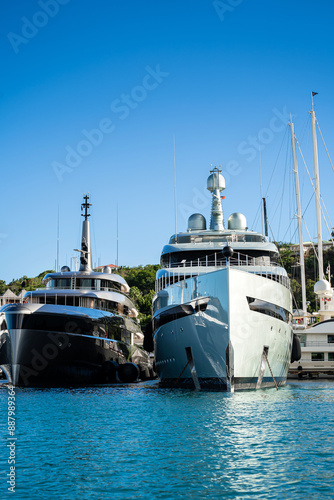 Beautiful mega and superyachts at dock in English Harbour, a famous caribbean island of Antigua know for yacht season photo