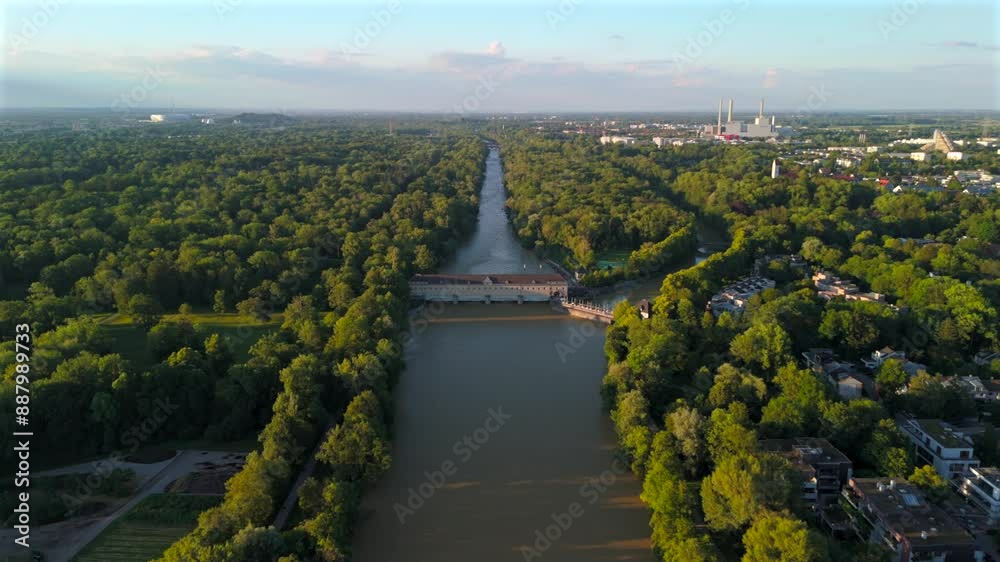 Stauwehr Oberfoehring Muenchen, Bayern, Deutschland Luftaufnahme im Sommer. Dam on Isar River in Munich, Germany aerial view in summer. Top view of the English Garden and the dam on the River Isar. 
