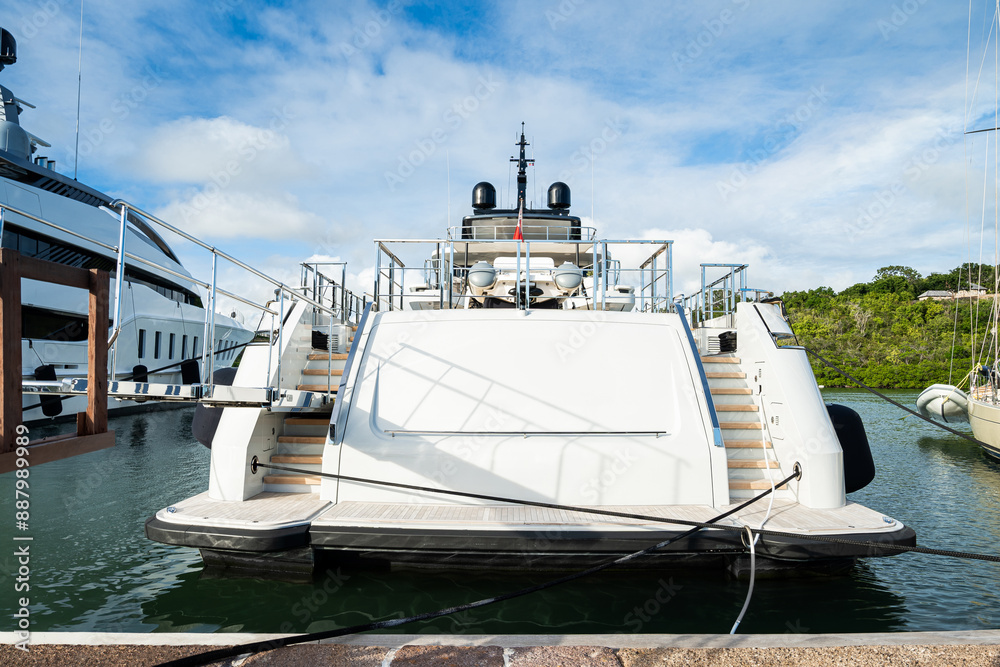 Fototapeta premium Beautiful mega and superyachts at dock in English Harbour, a famous caribbean island of Antigua know for yacht season