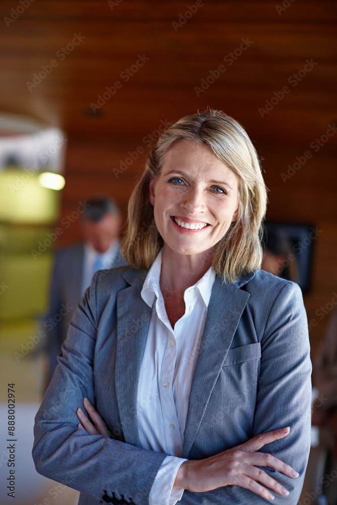 Shes in charge. Shot of a confident businesswoman standing in front of her team at the office. Shes in charge. Shot of a confident businesswoman standing in front of her team at the office.