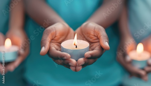 Group of people holding lit candles in a heartfelt vigil, illustrating unity, peace, and support. photo