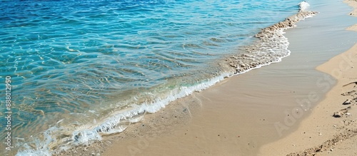 Fototapeta Naklejka Na Ścianę i Meble -  Sandy beach on the Mediterranean coast with empty clear sand providing a summer background and space for copy in the image