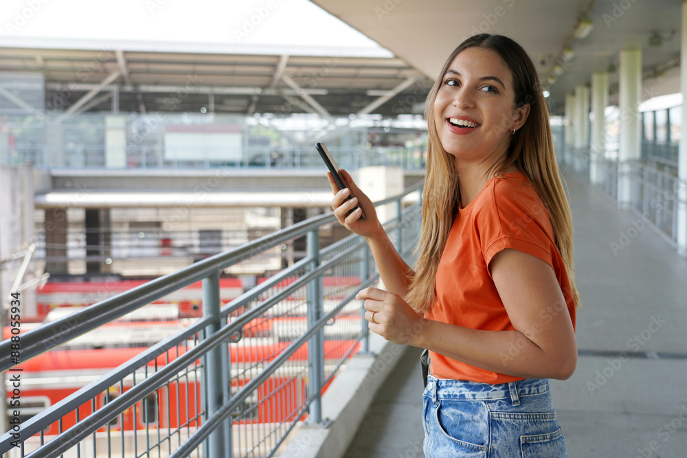 Pretty young Brazilian woman using her mobile phone walking in Sao Paulo metropolis, Brazil Pretty young Brazilian woman using her mobile phone walking in Sao Paulo metropolis, Brazil