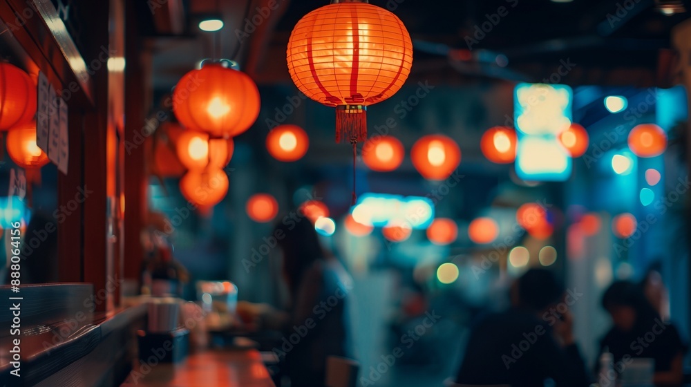 a restaurant with a lot of red lanterns hanging from the ceiling and people walking by the counter area in the background..