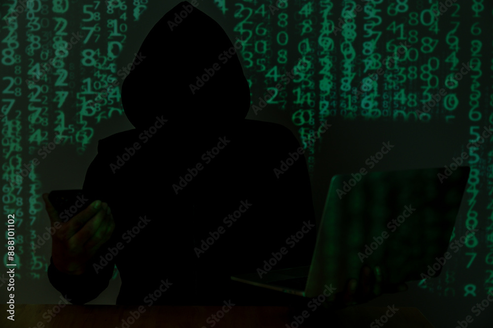 A man in black is hacking personal computer data, representing the concept of cybersecurity.