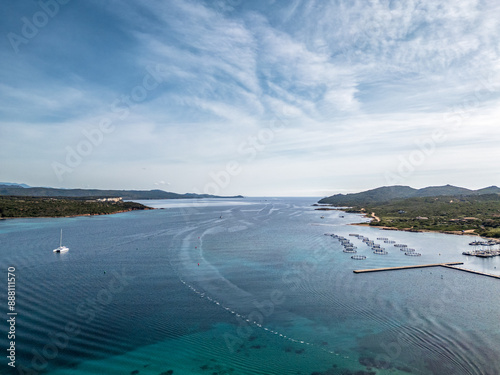 Aerial view looking across the Sant'Amanza Bay and Mediterranean sea from the Plage de Gandina on the south east coast of the island of Corsica photo