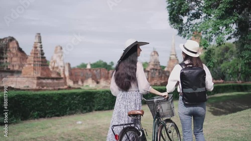 Tourist travel taking a photo temple in Ayutthaya historical park UNESCO world heritage site.