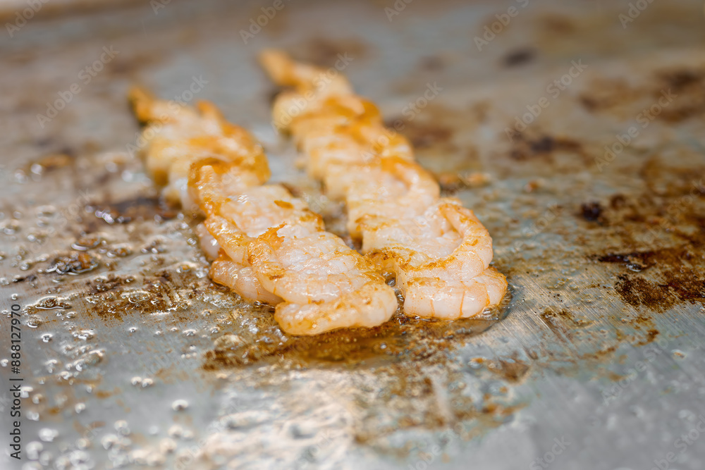 Cooking and frying shrimp on a stick in a restaurant kitchen. Cooking and frying shrimp on a stick in a restaurant kitchen.