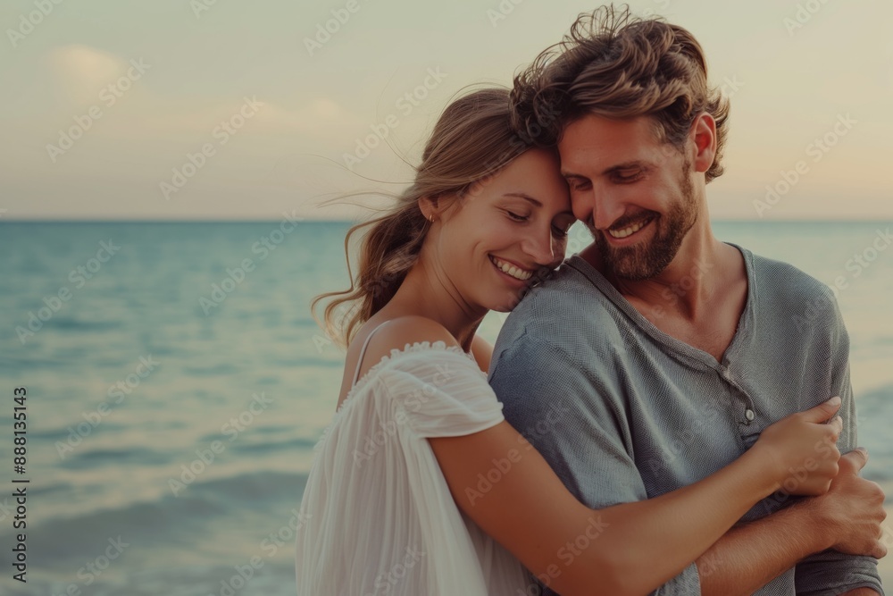 Happy couple embracing on beach during sunset romance concept Happy couple embracing on beach during sunset romance concept