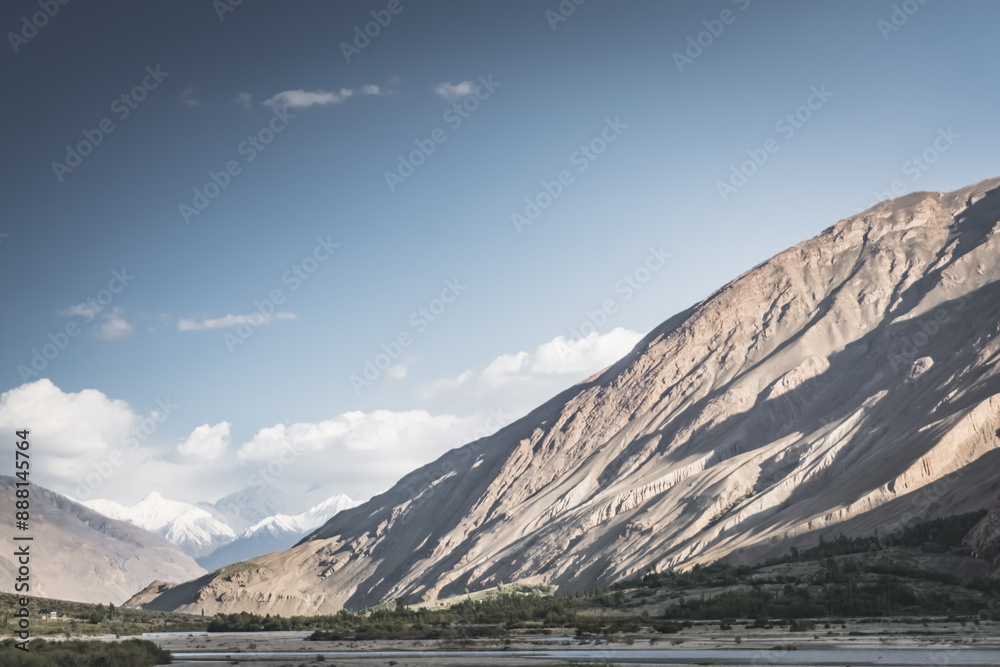 The Panj River flows between Afghanistan and Tajikistan along the Pamir Highway road in the Tien Shan mountains