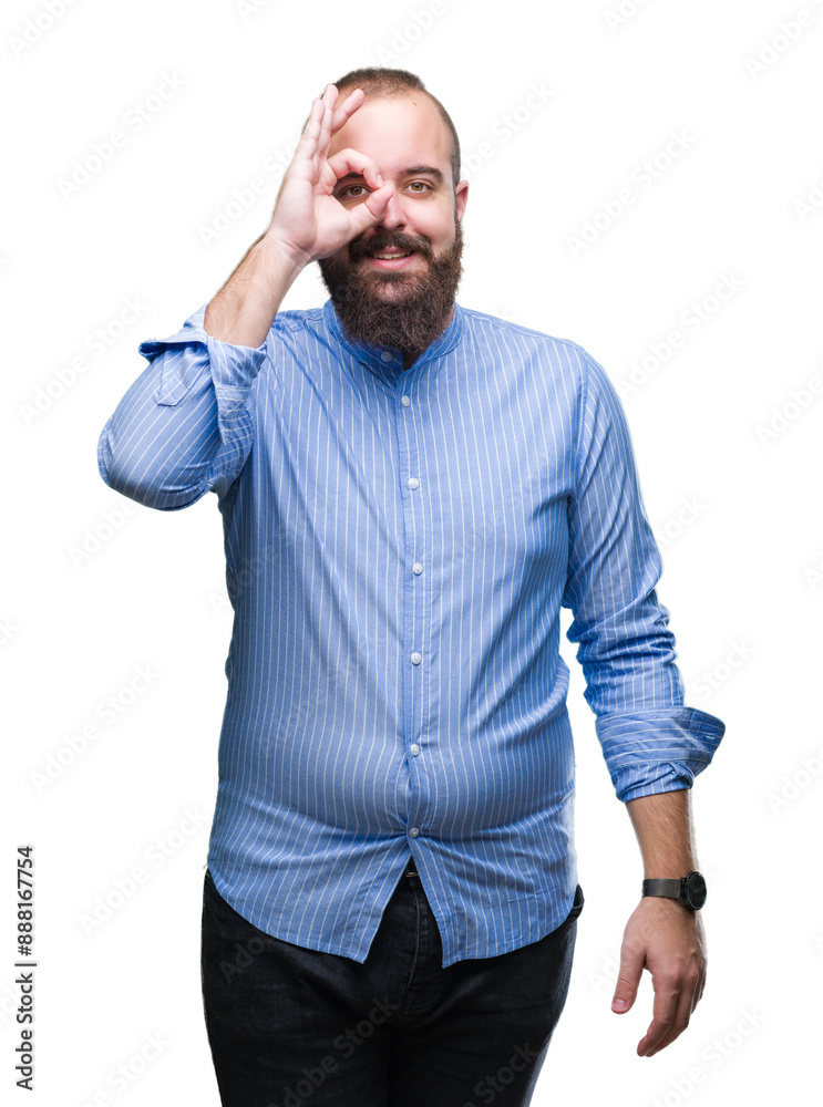 Young caucasian hipster man over isolated background doing ok gesture with hand smiling, eye looking through fingers with happy face. Young caucasian hipster man over isolated background doing ok gesture with hand smiling, eye looking through fingers with happy face.