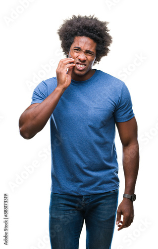 Afro american man over isolated background touching mouth with hand with painful expression because of toothache or dental illness on teeth. Dentist concept.