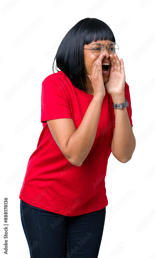 Beautiful young african american woman wearing glasses over isolated background shouting and screaming loud to side with hand on mouth. Communication concept. Beautiful young african american woman wearing glasses over isolated background shouting and screaming loud to side with hand on mouth. Communication concept.