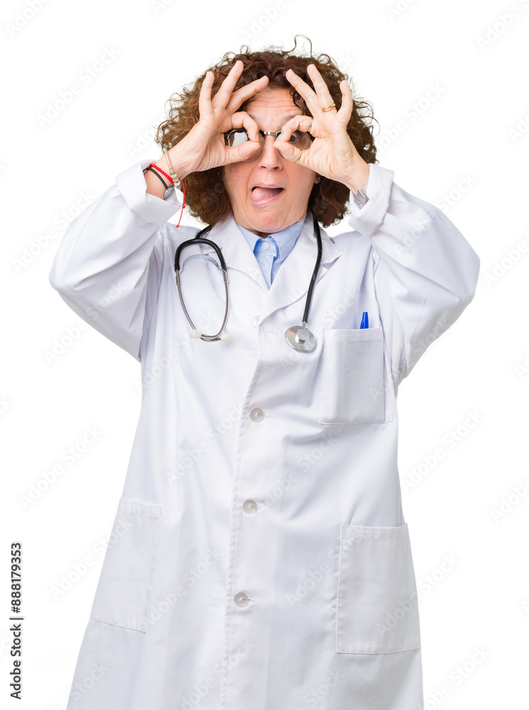 Middle ager senior doctor woman over isolated background doing ok gesture like binoculars sticking tongue out, eyes looking through fingers. Crazy expression. Middle ager senior doctor woman over isolated background doing ok gesture like binoculars sticking tongue out, eyes looking through fingers. Crazy expression.
