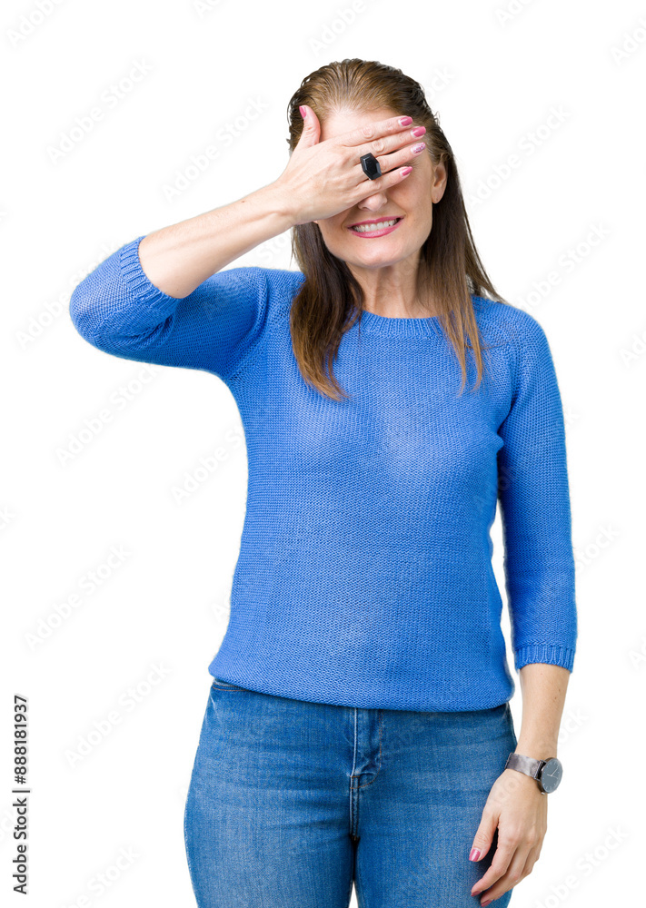 Beautiful middle age mature woman wearing winter sweater over isolated background smiling and laughing with hand on face covering eyes for surprise. Blind concept. Beautiful middle age mature woman wearing winter sweater over isolated background smiling and laughing with hand on face covering eyes for surprise. Blind concept.