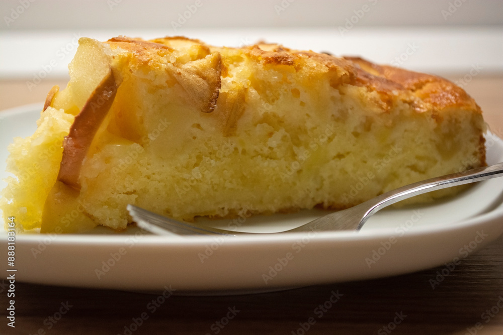 A mouthwatering slice of apple pie on a white plate. Baking apple pie A mouthwatering slice of apple pie on a white plate. Baking apple pie