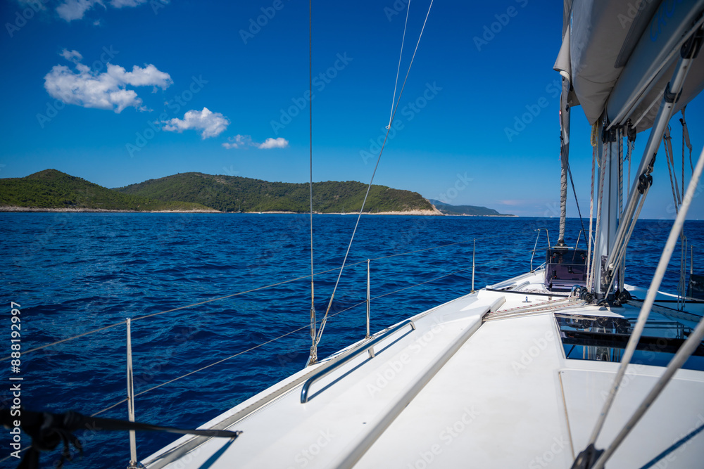 Fototapeta premium Yacht sailing near Croatia coast. Close-up view of the deck, mast and sails. Yachting concept
