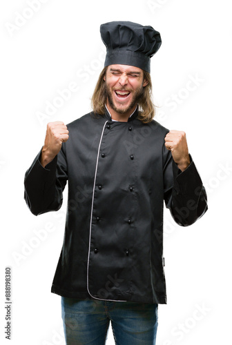 Young handsome cook man with long hair over isolated background very happy and excited doing winner gesture with arms raised, smiling and screaming for success. Celebration concept.