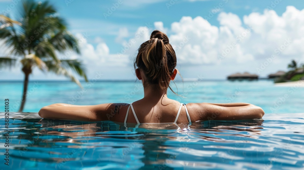 Naklejka premium A woman enjoying a day at a luxurious beach resort