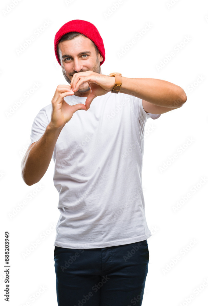 Young handsome man over isolated background smiling in love showing heart symbol and shape with hands. Romantic concept. Young handsome man over isolated background smiling in love showing heart symbol and shape with hands. Romantic concept.
