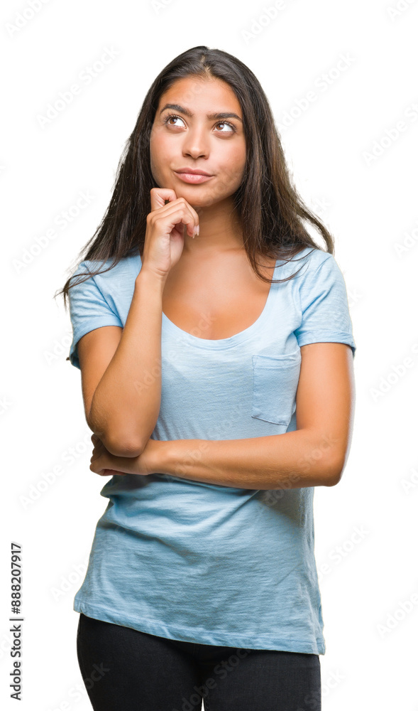 Fototapeta premium Young beautiful arab woman over isolated background with hand on chin thinking about question, pensive expression. Smiling with thoughtful face. Doubt concept.