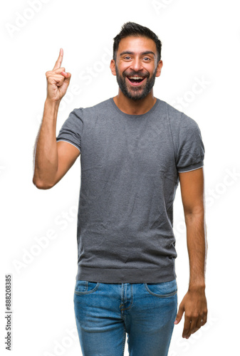 Adult hispanic man over isolated background pointing finger up with successful idea. Exited and happy. Number one.
