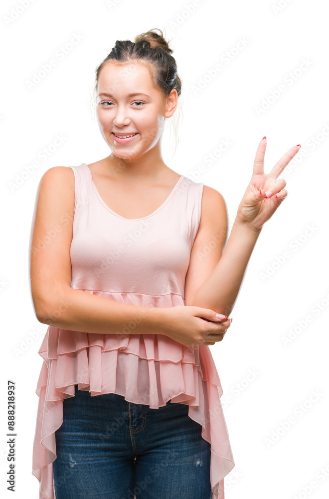 Young caucasian beautiful woman over isolated background smiling with happy face winking at the camera doing victory sign. Number two. Young caucasian beautiful woman over isolated background smiling with happy face winking at the camera doing victory sign. Number two.