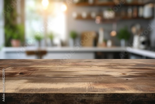 Wooden tabletop with free space for product display against white kitchen with cutting board and plant in scandinavian style in morning light