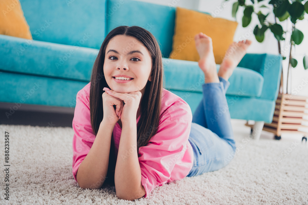 Photo of dreamy attractive girl dressed pink shirt smiling lying floor indoors house apartment room Photo of dreamy attractive girl dressed pink shirt smiling lying floor indoors house apartment room