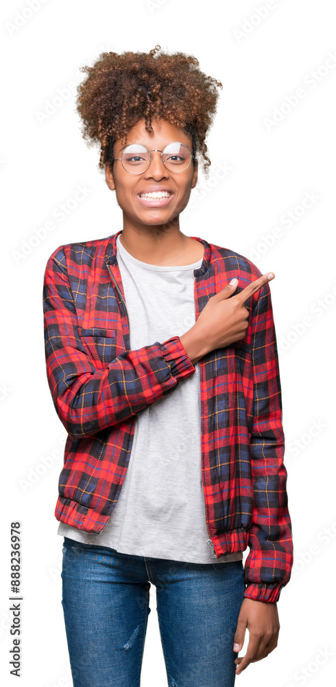 Beautiful young african american woman wearing glasses over isolated background cheerful with a smile of face pointing with hand and finger up to the side with happy and natural expression on face Beautiful young african american woman wearing glasses over isolated background cheerful with a smile of face pointing with hand and finger up to the side with happy and natural expression on face