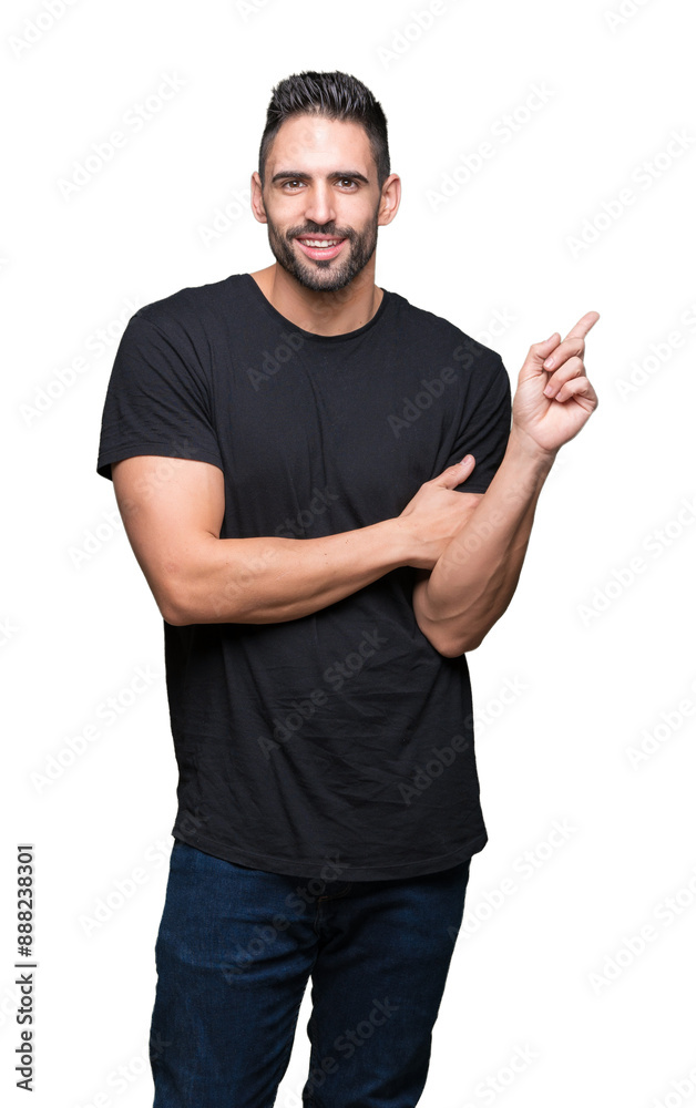 Fototapeta premium Young handsome man over isolated background with a big smile on face, pointing with hand and finger to the side looking at the camera.