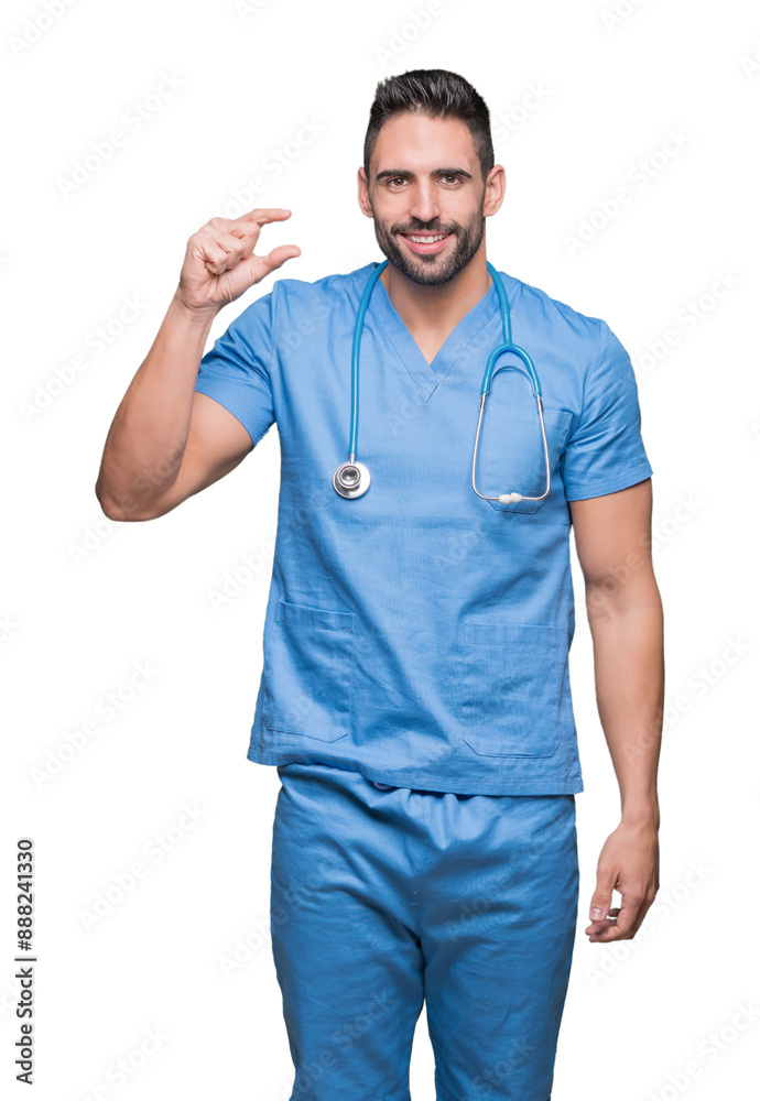 Handsome young doctor surgeon man over isolated background smiling and confident gesturing with hand doing size sign with fingers while looking and the camera. Measure concept.
