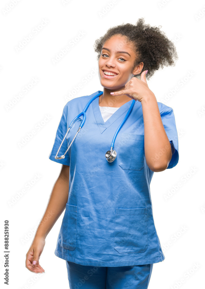 Young afro american doctor woman over isolated background smiling doing phone gesture with hand and fingers like talking on the telephone. Communicating concepts. Young afro american doctor woman over isolated background smiling doing phone gesture with hand and fingers like talking on the telephone. Communicating concepts.
