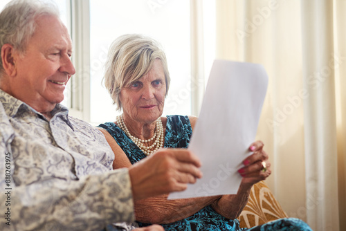 Budget, senior couple and reading paperwork for mortgage, savings or investment contract in home. Retirement, happy man and woman with document for financial planning, insurance or asset management