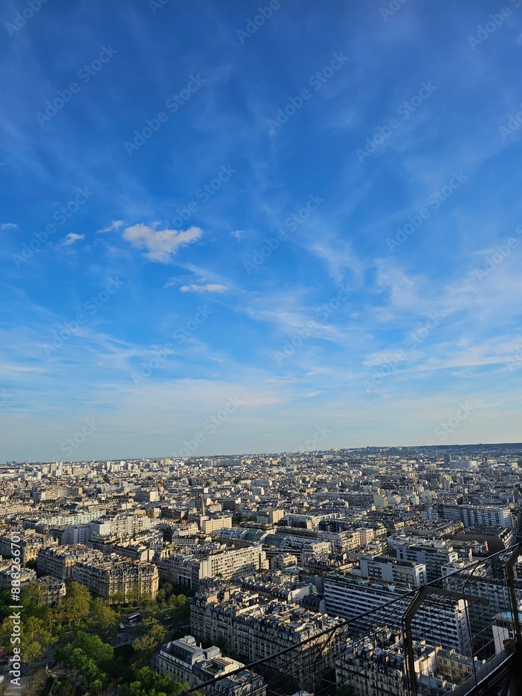 Fototapeta premium Paris, France - April 12, 2024: Aerial view of Paris skyline with dense urban sprawl and modern skyscrapers, Ile de France, France. Amazing mix between modern skyscraoers and old buildings.