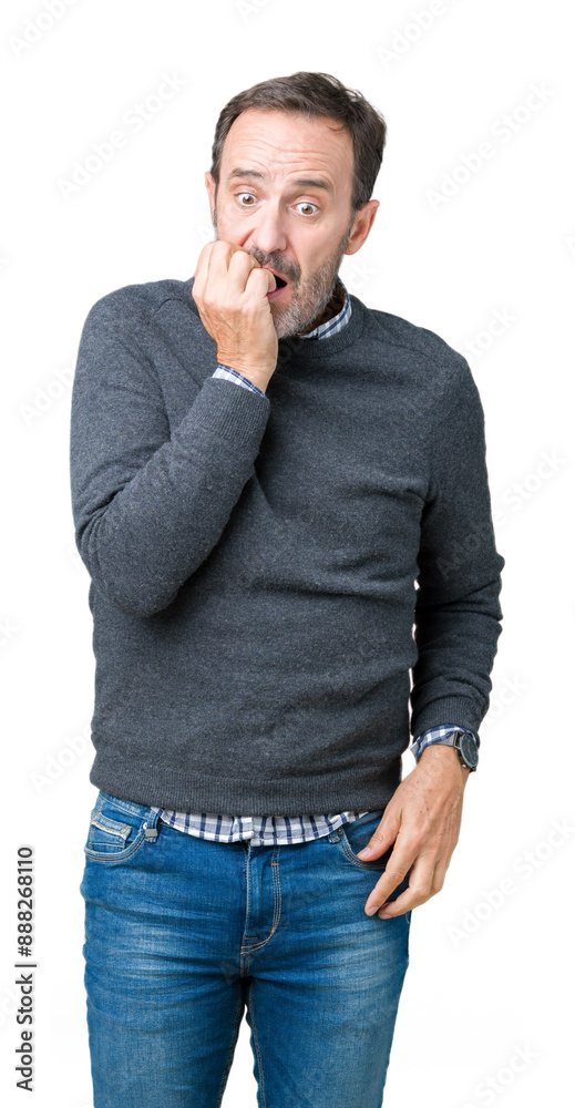 Handsome middle age senior man wearing a sweater over isolated background looking stressed and nervous with hands on mouth biting nails. Anxiety problem. Handsome middle age senior man wearing a sweater over isolated background looking stressed and nervous with hands on mouth biting nails. Anxiety problem.