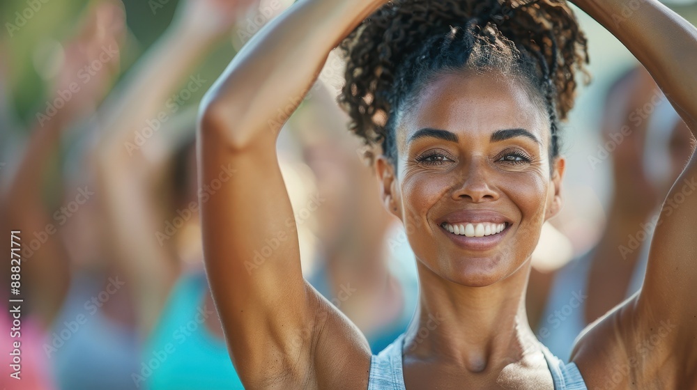A cheerful woman with a vibrant smile raises her arms during an outdoor fitness session, showcasing joy, community, and healthy living in a sunny environment. A cheerful woman with a vibrant smile raises her arms during an outdoor fitness session, showcasing joy, community, and healthy living in a sunny environment.